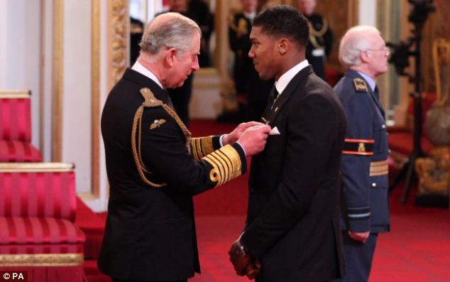 Joshua receives OBE award from Prince Charles