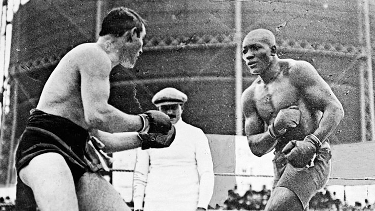 Today in Sports History: African-American boxer Jack Johnson stops Canadian defending champion Tommy Burns to become first black man to win world heavyweight title