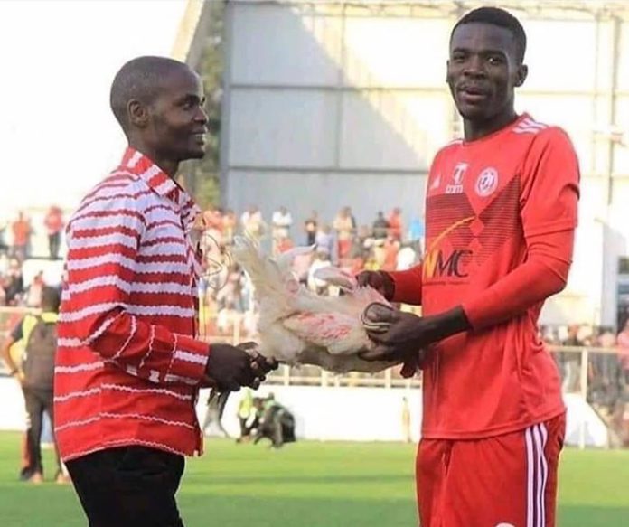 Photo: Player receives live chicken for being Man-of-the-match in Malawi