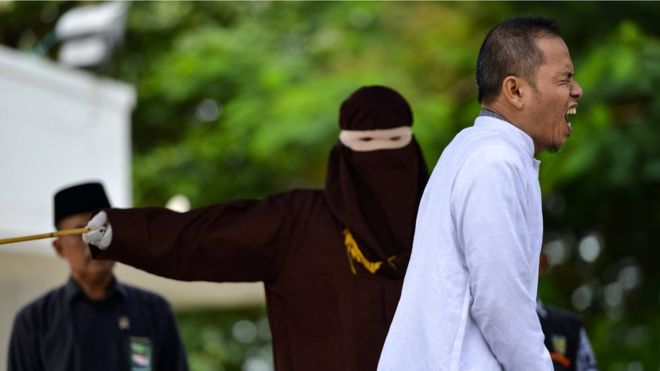 Indonesian man who helped set strict adultery laws flogged for adultery