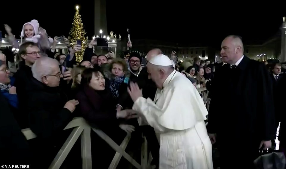 Pope Francis apologises after slapping a female worshipper who grabbed his hand