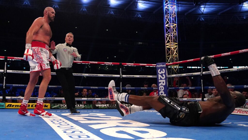 Tyson Fury knocks out Dillian Whyte to retain WBC heavyweight title in front of sell-out Wembley